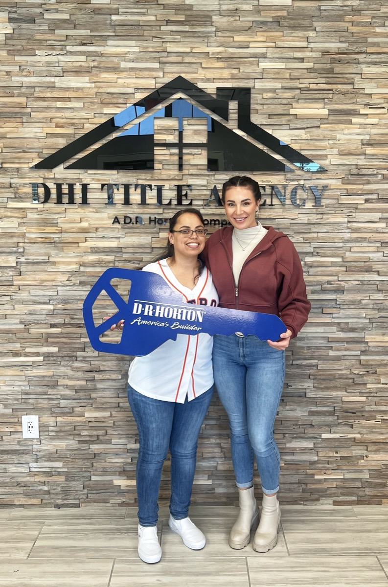 Clients celebrating at the title company